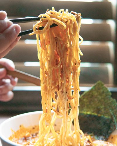 Chopsticks Holding Ramen Noodles
